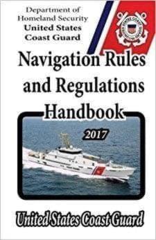 uscg USCG navigation rule book has a coast guard rescue boat on the cover