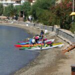 getting ready to launch kayaks from a pebble beach in Poros, Greece