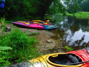 kayaks resting along Cedar Creek, Cedarburg Wi