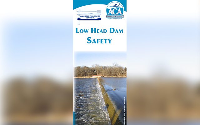 A safety barrier over a water spillway labeled Low Head Dam Safety.